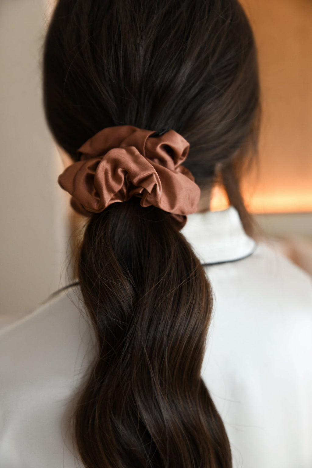 Large mulberry silk hair scrunchie in woman's hair. The r and r collective.