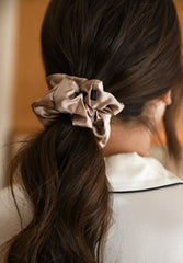 Large mulberry silk hair scrunchie in woman's hair. The r and r collective.