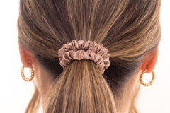 Silk hair scrunchie in woman's hair. The r and r collective.